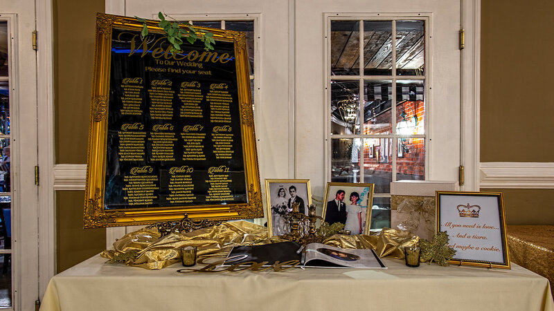 Table with party decorations and photos